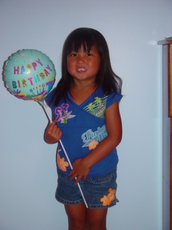 Kasen with Happy Birthday balloon
